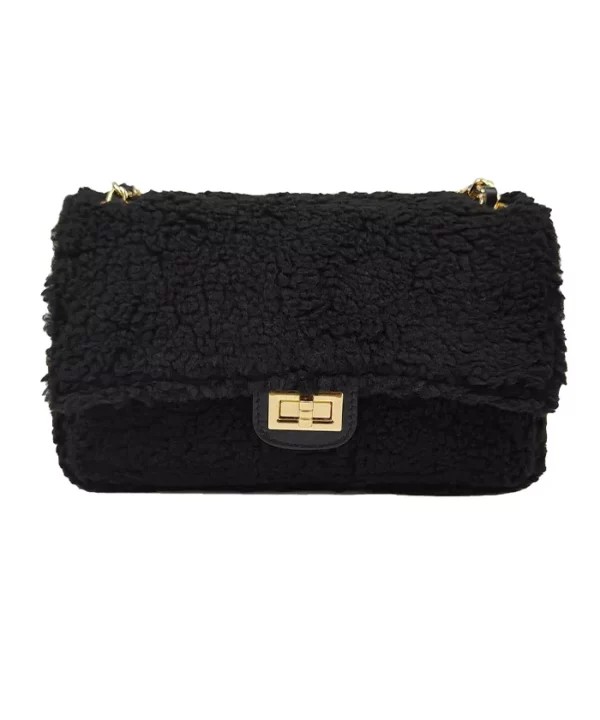 Ce sac à main effet mouton garni cuir est un accessoire au style chic et tendance. Ce sac possède une bandoulière dorée réglable en cuir, vous permettant de le porter de différentes manières : à la main, à l'épaule ou en croisé. L'intérieur de ce sac est également très pratique, avec deux compartiments séparés par une fermeture éclair et une poche latérale zippée | Dovelya